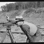 Surveyor holding hand up